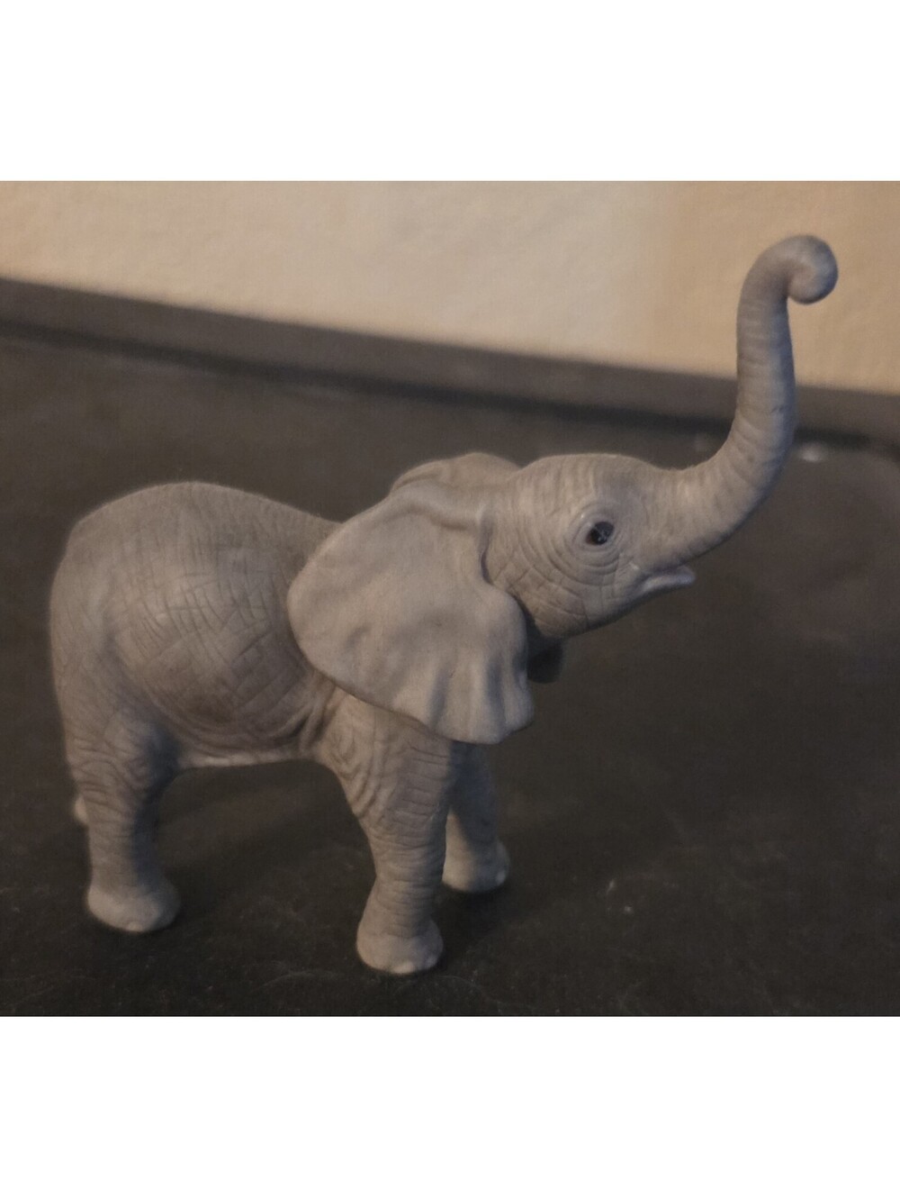 The figurine is a Safari Ltd. Wild Safari Wildlife African Elephant Baby